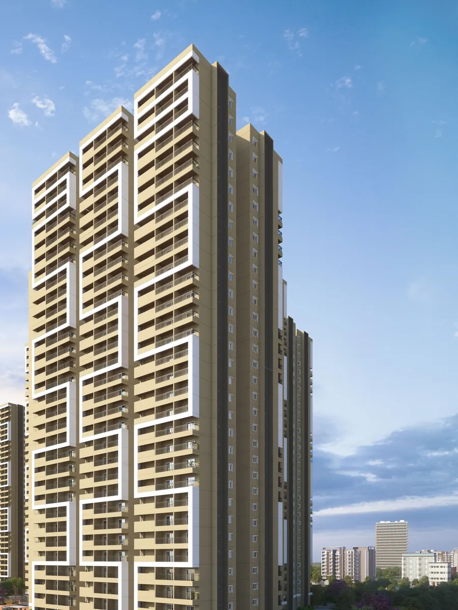 A tall apartment tower under a bright sky at Candeur Eternia