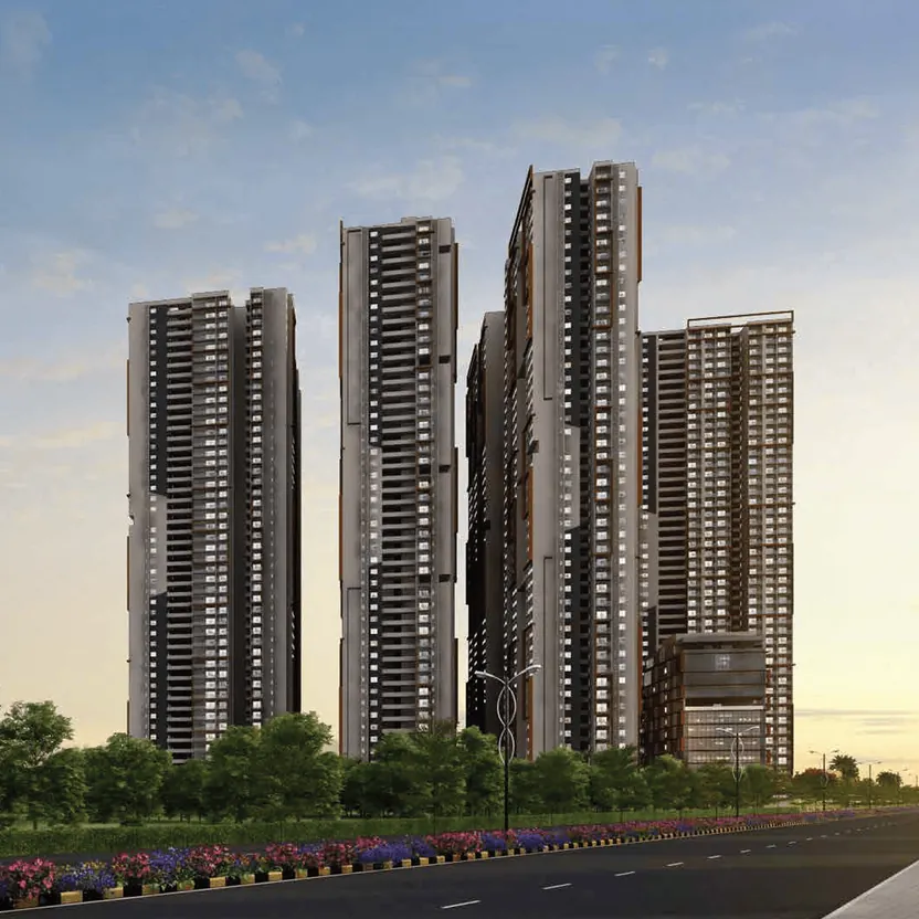 Towers rising beyond a landscaped boulevard at Candeur Lakescape